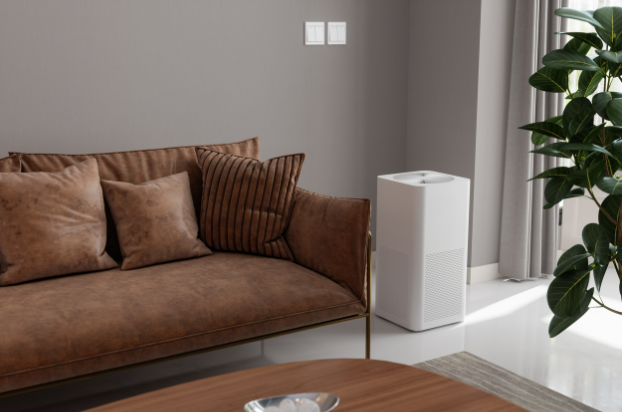 Air purifier running in a living room, filtering dust for cleaner air and a healthier home.