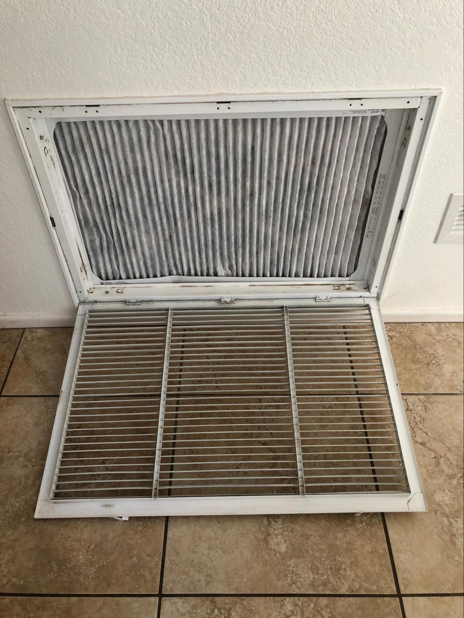 picture of a clean filter inside of an open vent